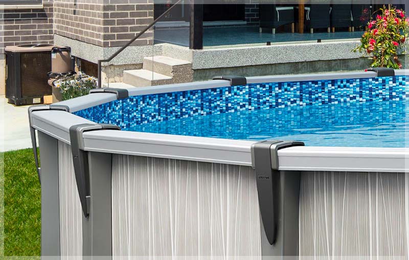 Close-up of an above-ground pool liner with blue mosaic tiles.